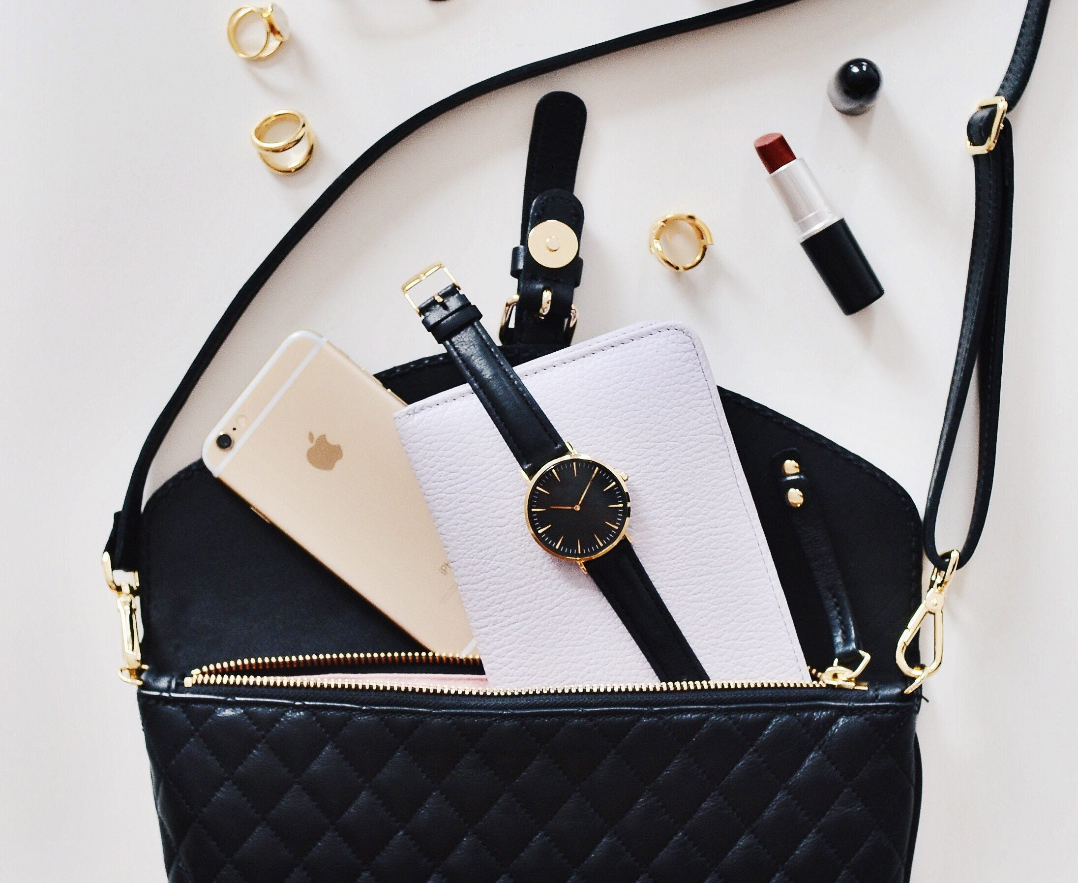 9 Products Every Woman Needs To Have In Her Purse Year Round